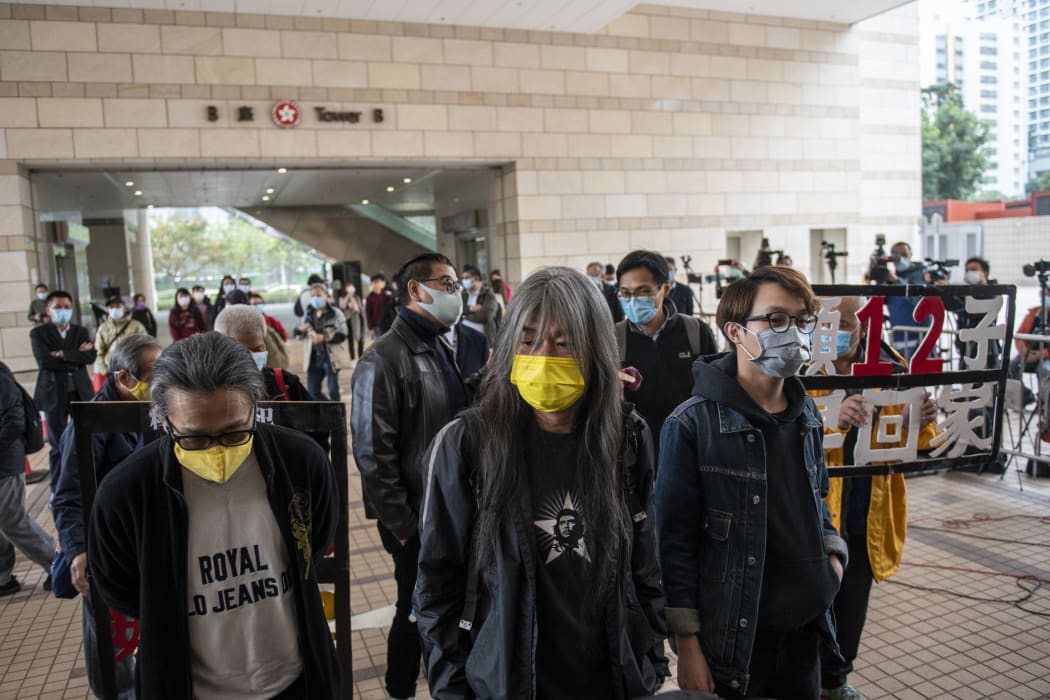 “Long Hair” Leung Kwok-hung (M) and Figo Chan(R) are seen entering a Hong Kong court in December. Leung Kowk-Hung , Figo Chan, Tsang Kin-Shing , former lawmaker Eddie Chu and Wu Chi-wai are all charged with crimes related to the Anti-National Security Protest on July 1, 2020 .