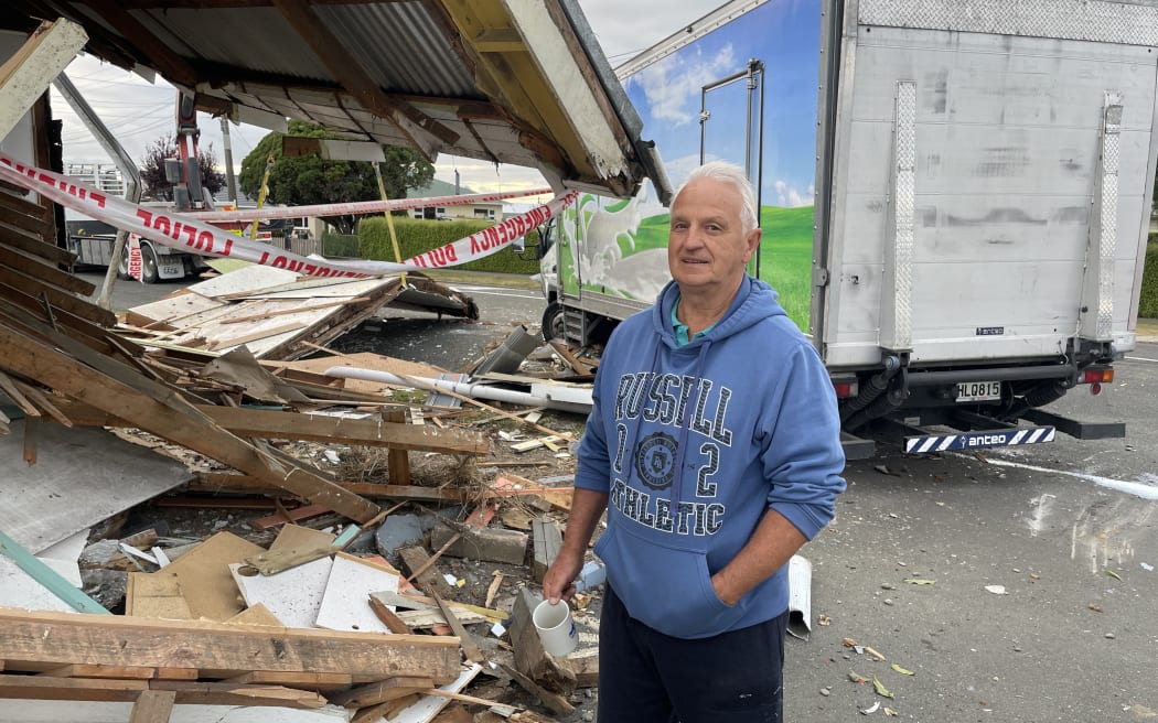 Peter Cartwright surveys the damage after a truck hit a car and his house in North End, Oamaru.