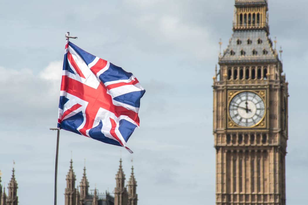 A Union Flag against the backdrop of British Parliament's Big Ben.