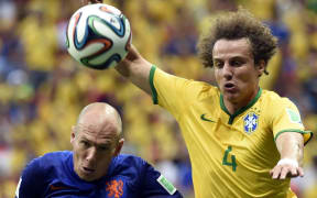 Netherlands Arjen Robben challenged by Brazils David Luiz during the third place play-off match between Brazil and Netherlands of 2014 FIFA World Cup.