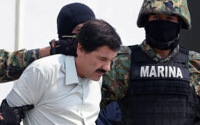 Mexican drug trafficker Joaquin Guzman escorted by marines.