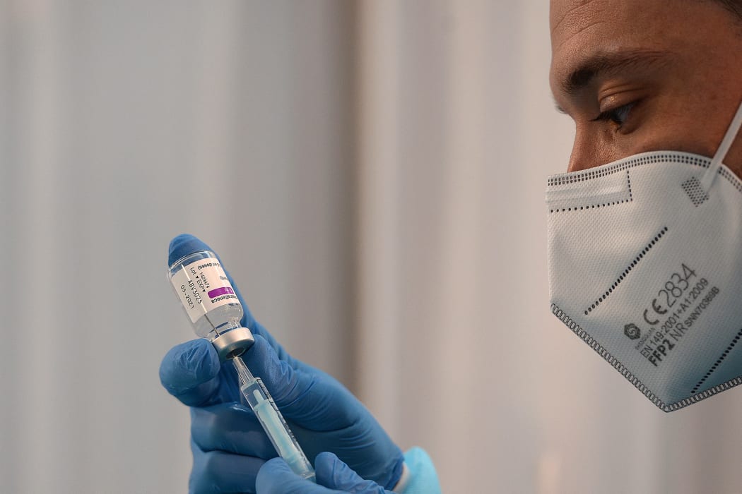 A health worker prepares a dose of the AstraZeneca vaccine against Covid-19.