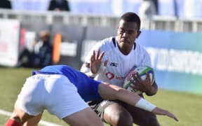 Fiji fullback Osea Waqa challenges the French defence.