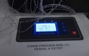 Temperature display on a freezer which will be used to store Pfizer-BioNTech Covid-19 vaccine vials.