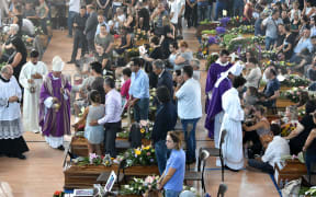 People attend a funeral service in Ascoli Piceno for victims of the earthquake.