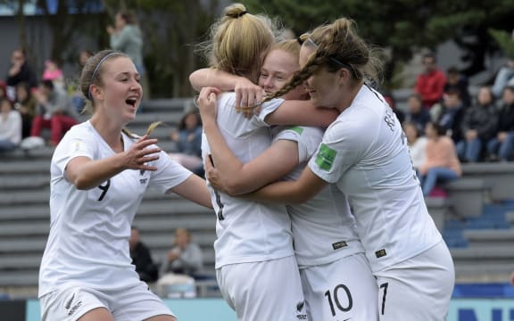 New Zealand's Grace Wisnewski (2-R) celebrates with teammates after scoring against Canada in the U-17 Women's World Cup football match for the third place in Montevideo.