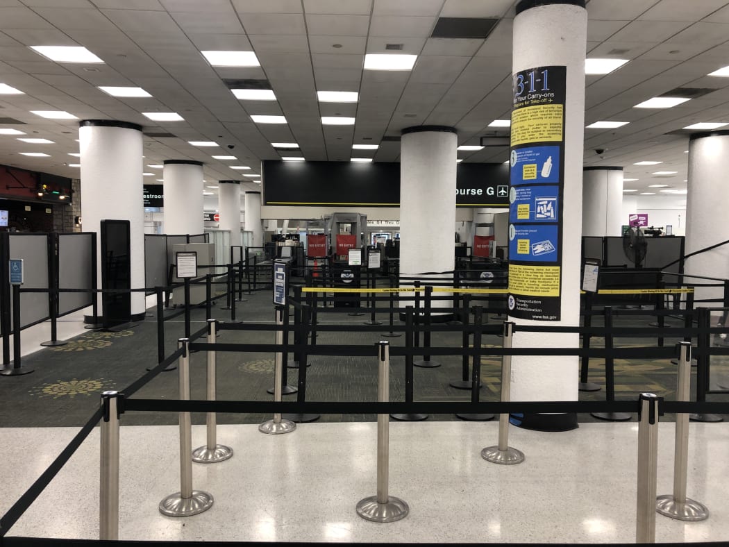 Terminal G security checkpoint of Miami International Airport is deserted on Saturday, January 12, 2019 after it was forced to shut down due to a shortage of security agents.
