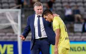 A dejected looking Ulises Davila of the Phoenix with coach,  Ufuk Talay, post-game at the A-League match,  Sydney FC v Wellington Phoenix at Netstrata Jubilee Stadium, Monday 8th February 2021.