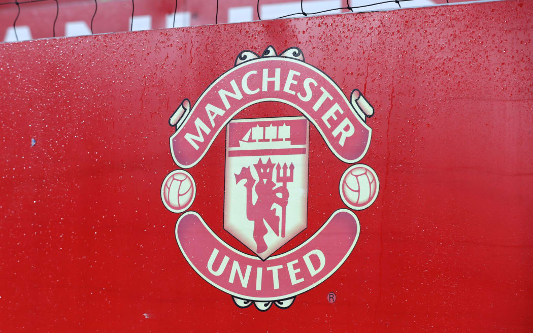 The Manchester United FC crest on a hoarding