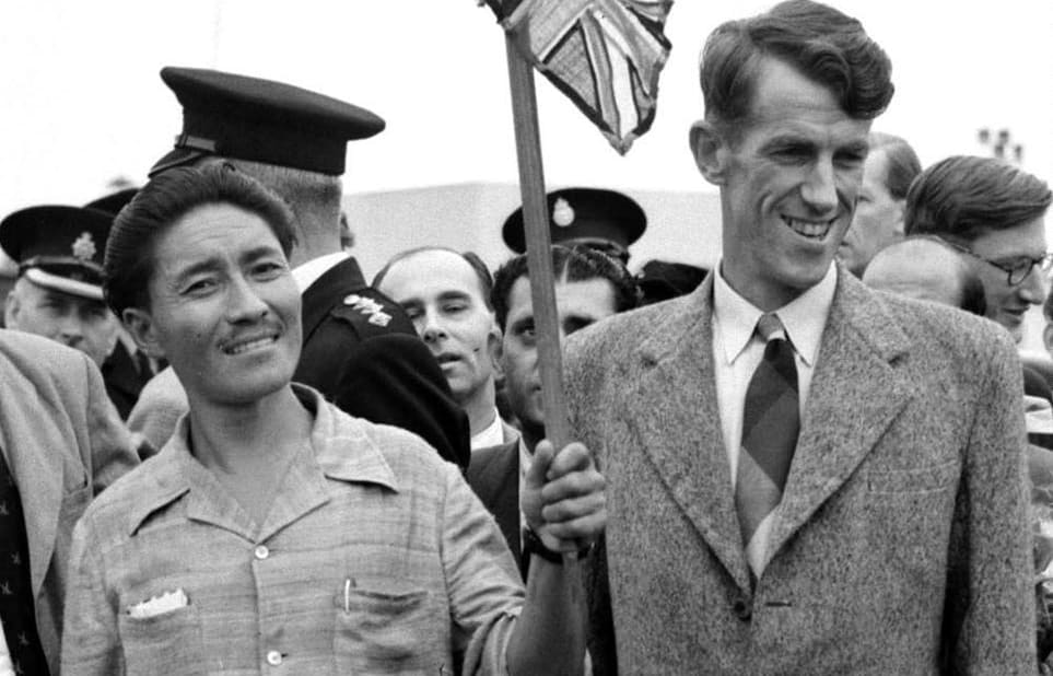 (FILES) Picture dated 03 July 1953 of Mount Everest conquerors Edmund Hillary (R) and Sherpa Tenzing Norgay (L) at London's Heathrow airport on their arrival from the expedition.