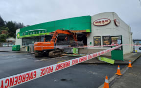An excavator used to smash into a service station in Wainuiomata, Lower Hutt.