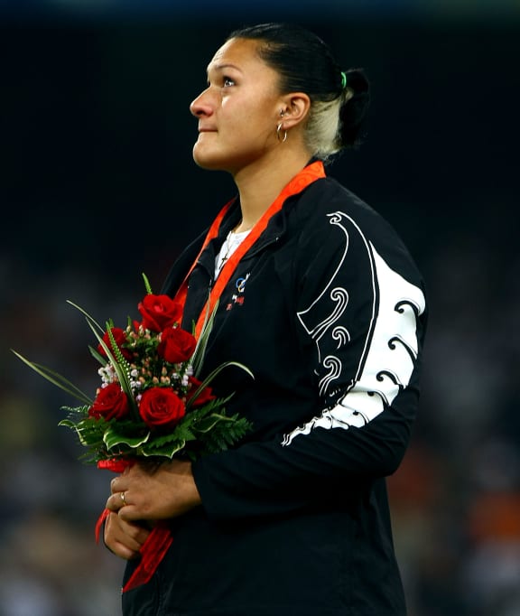 Olympic champion shotputter Valerie Vili collects her gold at the 2008 Beijing Olympic Games.