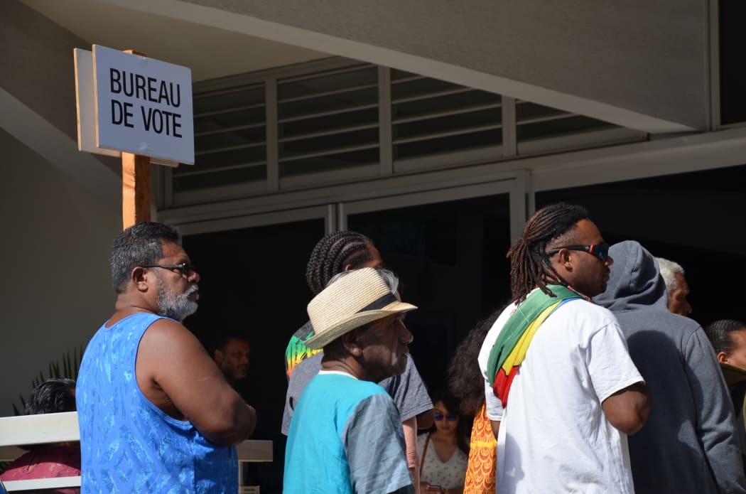 Voters on New Caledonia's restricted roll line up in 2018 independence referendum