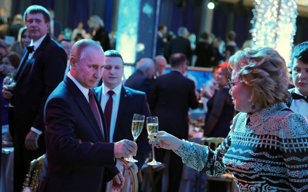 Russian President Vladimir Putin at the reception to mark the New Year holiday at the Kremlin, seen with Federation Council Speaker Valentina Matviyenko on 27 December, 2017.