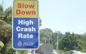 A sign on SH2 warning motorists to slow down.