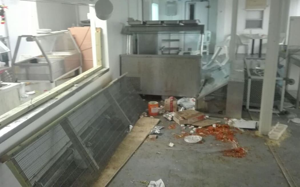 Destruction caused by the brawl in Mike Compound dining area.