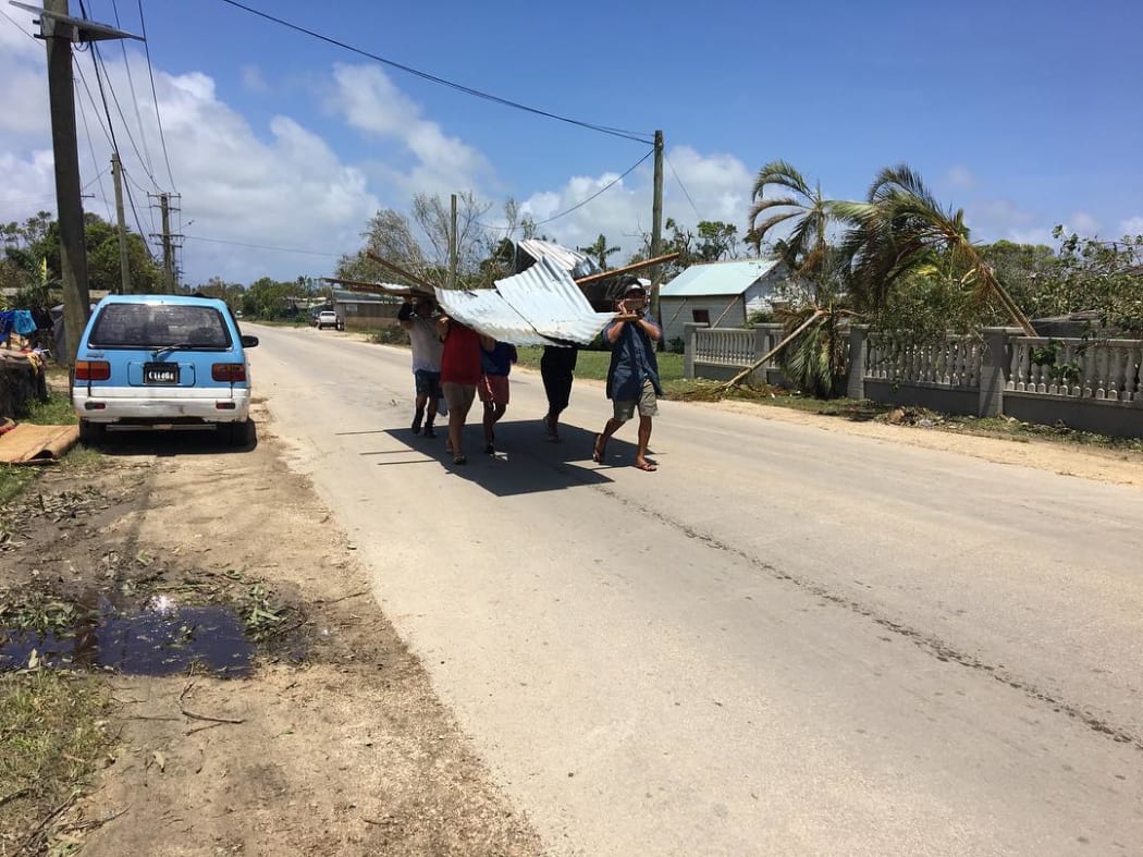 Tongans looking for material to rebuild.