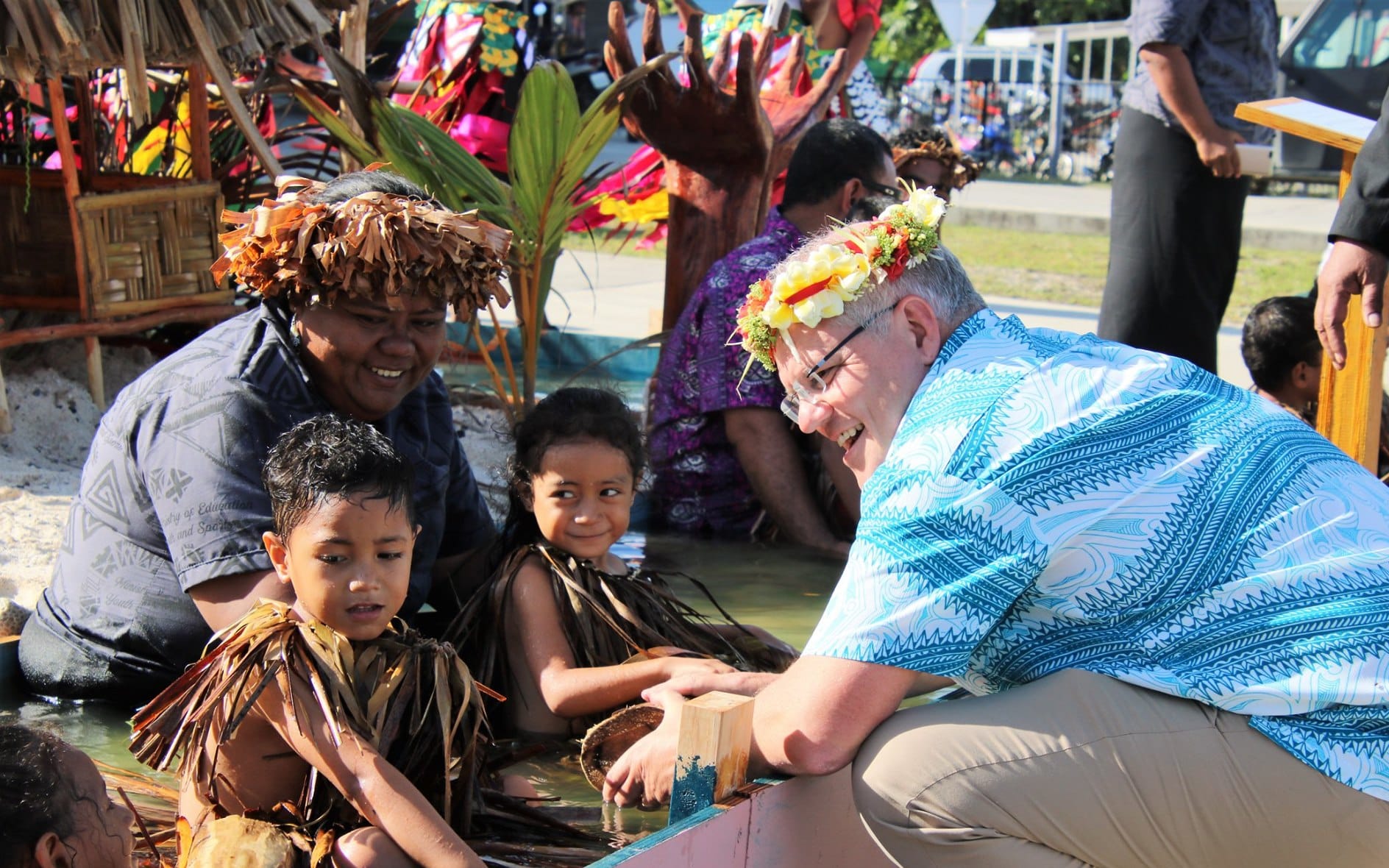 Australian prime minister Scott Morrison speaks to kids at a climate change display in Tuvalu ahead of the Pacific Islands Forum leaders summit on Funafuti. August 2019
