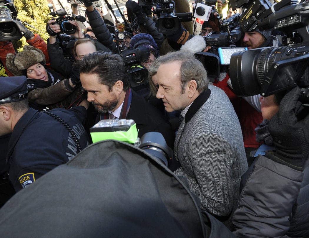 US actor Kevin Spacey wades through a media frenzy as he makes his appearance during his arraignment on January 7, 2019 at the Nantucket District Court, in Nantucket, Massachusetts.