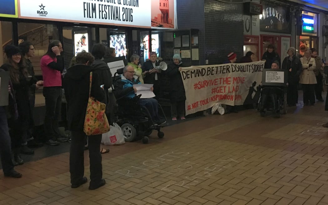People outside the Embassy Theatre in Wellington protest the movie ‘Me Before You’.