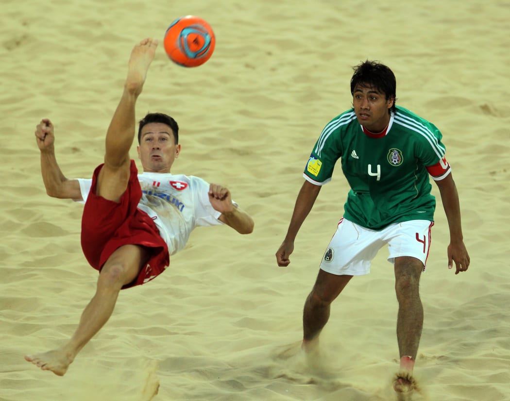 Angelo Schirinzi (L) playing for the Switzerland national beach soccer team in Dubai in 2011.