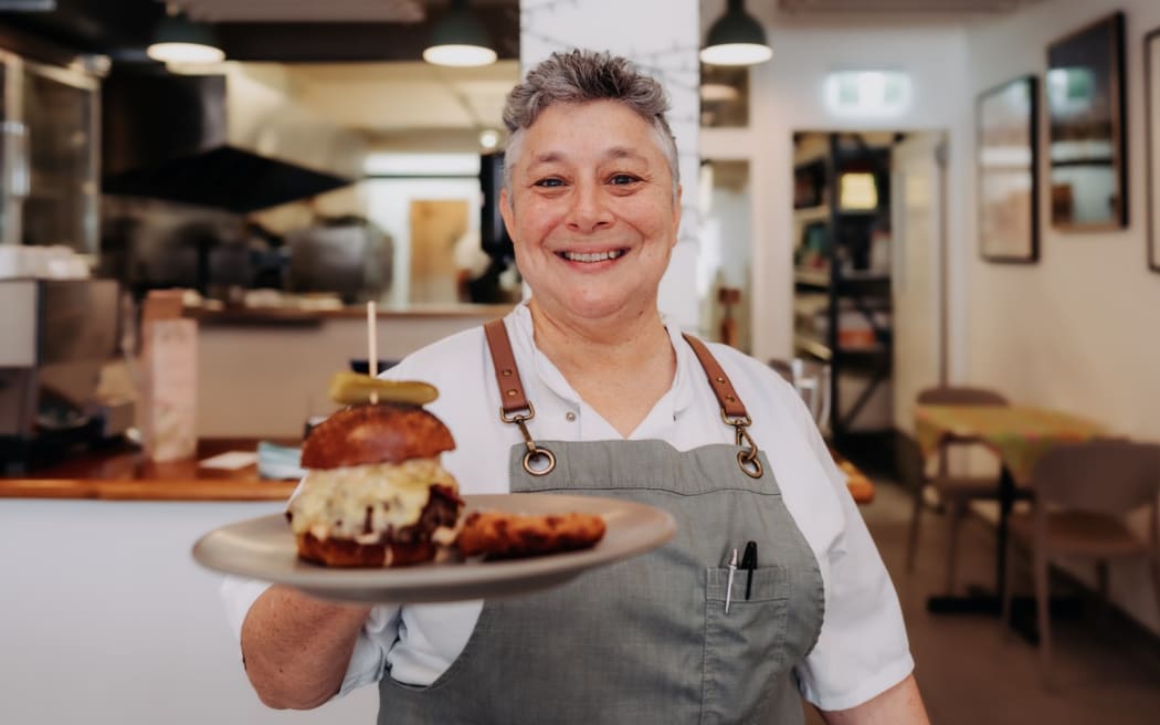 Field & Green chef/owner Laura Greenfield with their Reuben-esque burger.