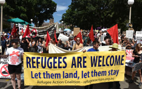A large number of people from different walks of life holding banners and placards marched to the US consulate protesting against Trump's travel ban policy and demanded Australian government to settle all the refugees and asylum seekers in the county.
