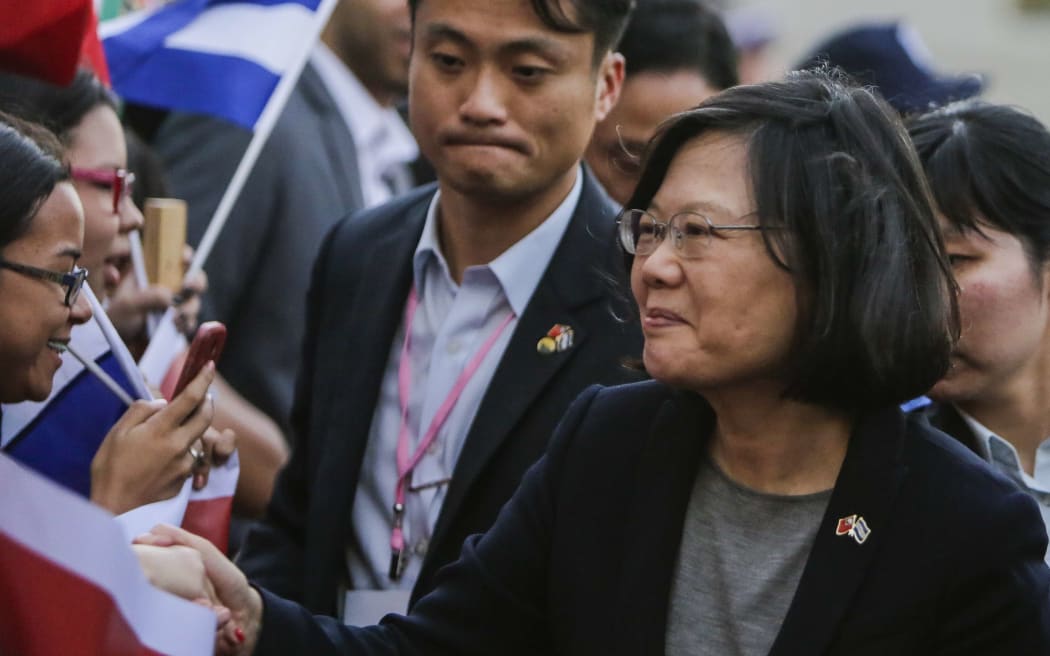 The President of Taiwan Tsai Ing-wen (R) greets Taiwanese people living in Nicaragua during her visit for the inauguration of President Daniel Ortega's fourth term in Managua, on January 9, 2017.