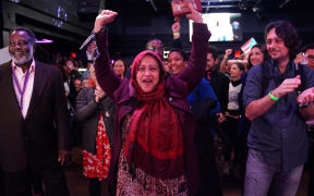 Supporters of Democrat Alexandria Ocasio-Cortez cheer during her election night party in New York.