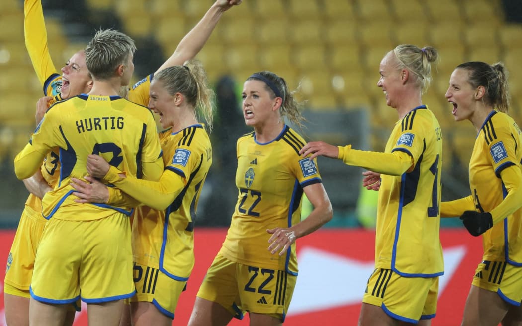 Sweden's defender #13 Amanda Ilestedt (L) celebrates scoring her team's second goal with teammates during the Australia and New Zealand 2023 Women's World Cup Group G football match between Sweden and South Africa at Wellington Stadium, also known as Sky Stadium, in Wellington on July 23, 2023. (Photo by Marty MELVILLE / AFP)