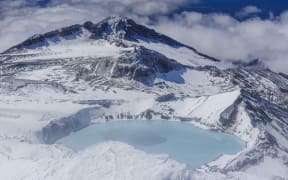 Aerial of a turquoise crater lake on top of Mount Ruapehu, Tongariro National Park, UNESCO World Heritage Site, North Island, New Zealand.