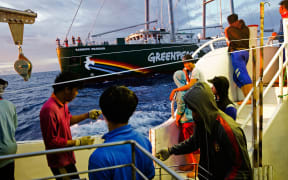 Crew of illegal fishing vessel Shuen De Ching No.888 look on as the Rainbow Warrior pulls up alongside. The Rainbow Warrior travels in the Pacific to expose out of control tuna fisheries. Tuna fishing has been linked to shark finning, overfishing and human rights abuses. 9 Sep, 2015