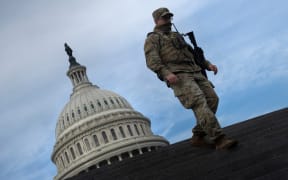 A member of the National Guard provides security at the US Capitol on January 14, 2021, in Washington, DC, a week after supporters of US President Donald Trump attacked the Capitol, and ahead of the inauguration of President-elect Joe Biden on January 20.