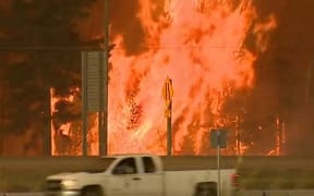 Thousands of people are fleeing Fort McMurray in Canada as a fire threatens the city.