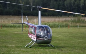 A file photos shows a Robinson R44 helicopter taking off in Latvia in 2011.