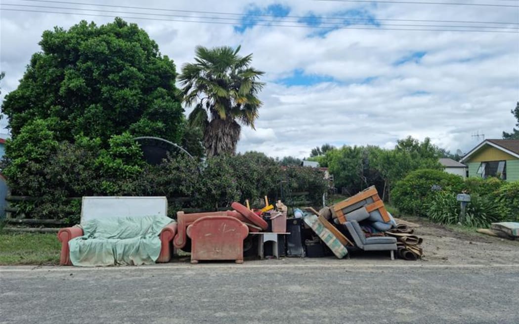 Flood damaged property dumped on the roadside in Omahu