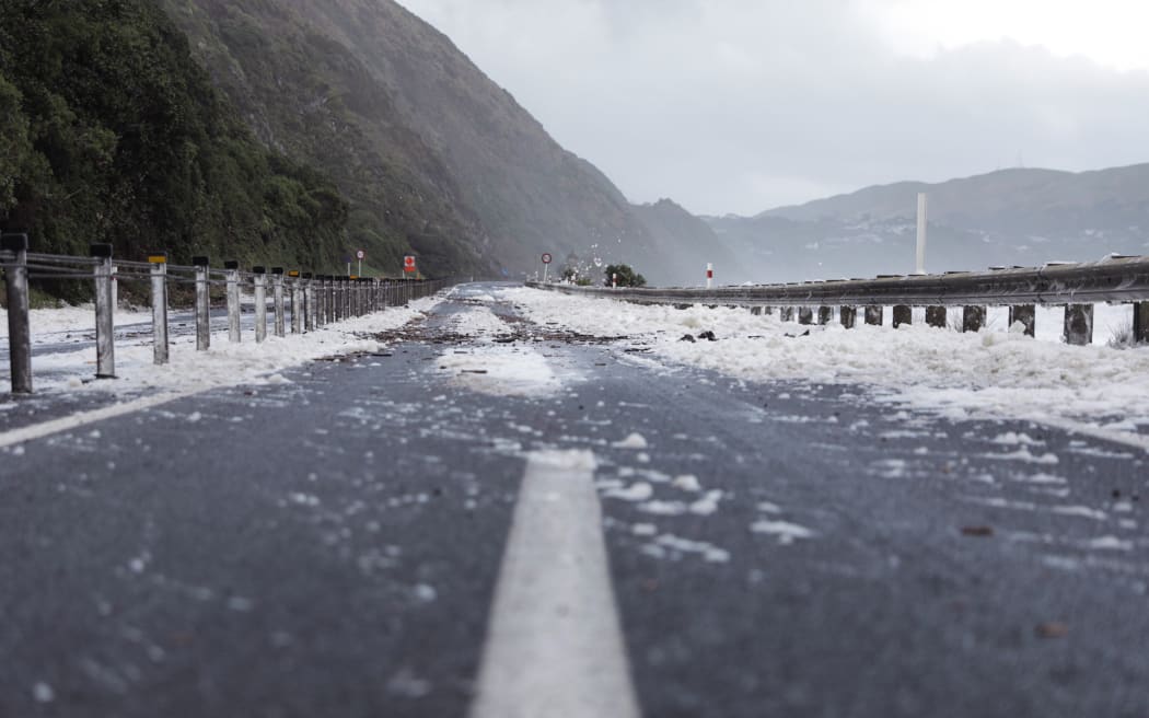 Waves across SH59 just south of Paekākāriki in stormy weather, 13 June 2022.