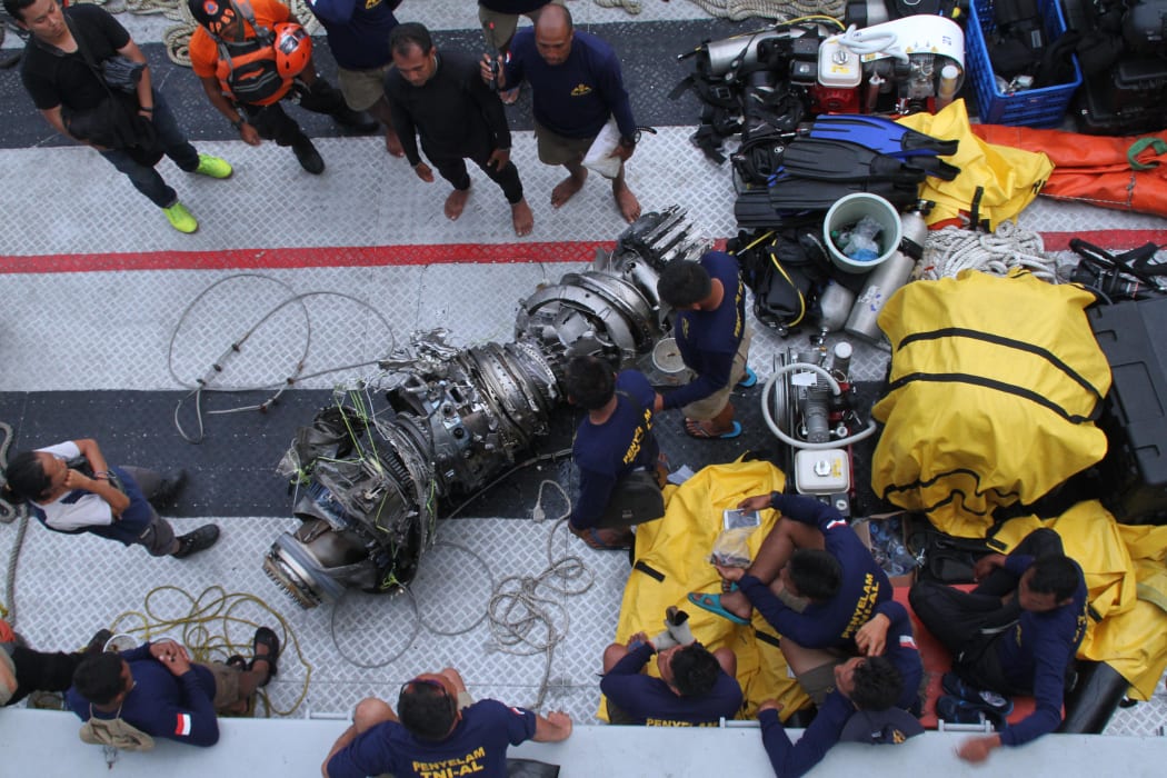 Parts of an engine of the ill-fated Lion Air flight JT 610 are recovered from the sea during search operations in the Java Sea.