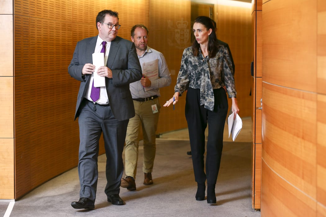 Prime Minister Jacinda Ardern and Finance Minister Grant Robertson arrive at a press conference at Parliament.
