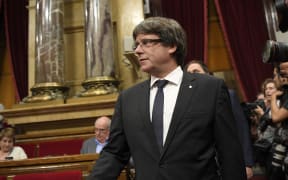Catalan regional government president Carles Puigdemont arrives to give a speech at the Catalan regional parliament in Barcelona.