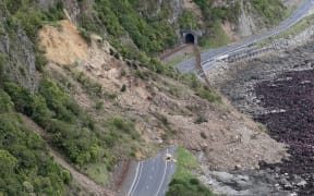 An aerial photo showing earthquake damage to State Highway One near Ohau Point.