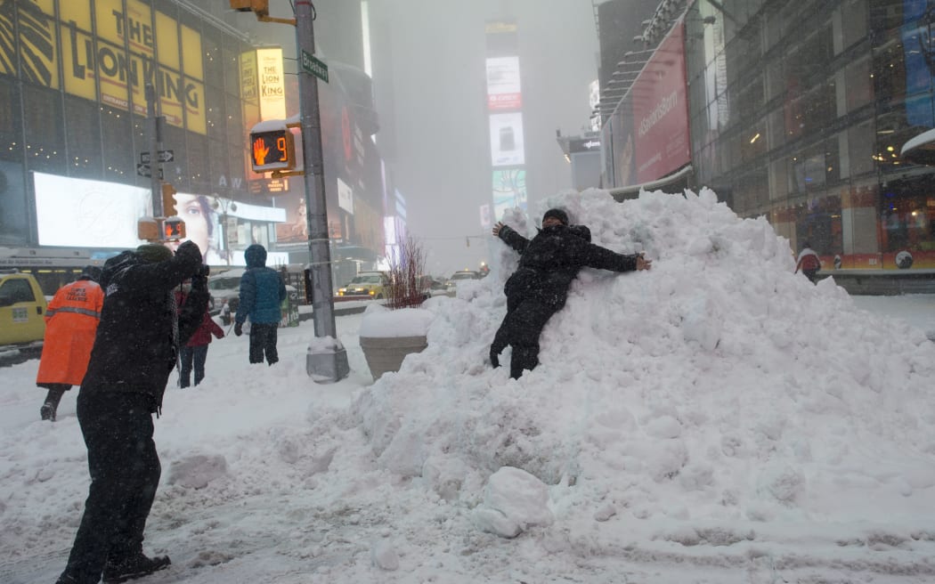 Snow piles up in Times Square, New York City.