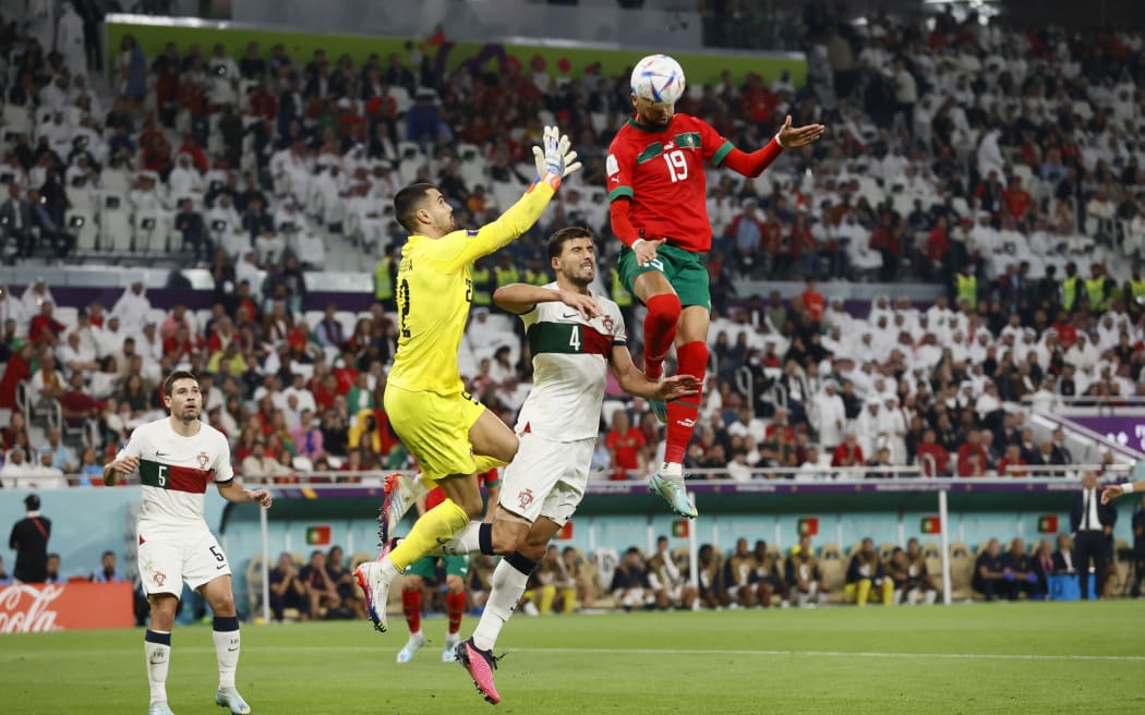 Youssef En Nesyri of Morocco scores against Portugal in their 2022 World Cup quarter-final.