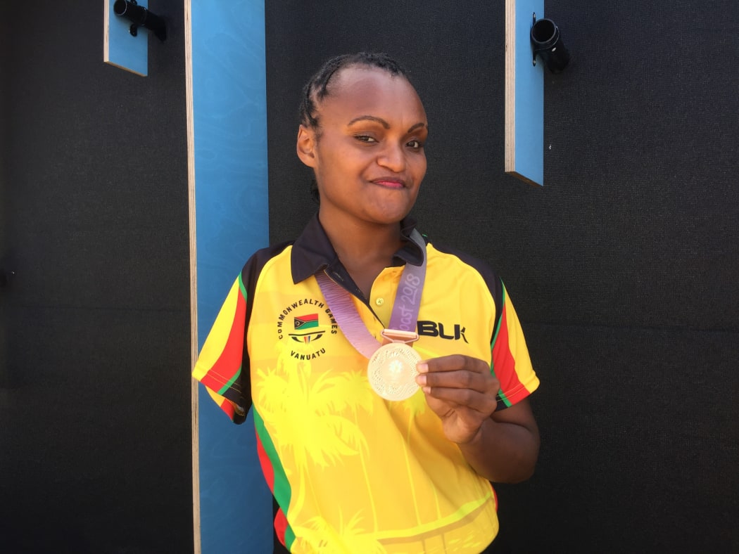 Friana Kwevira with her gold medal