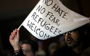 Protesters gathered outside of the Brooklyn Federal Courthouse as a judge heard a challenge against President Donald Trump's executive ban on immigration from several Muslim countries.