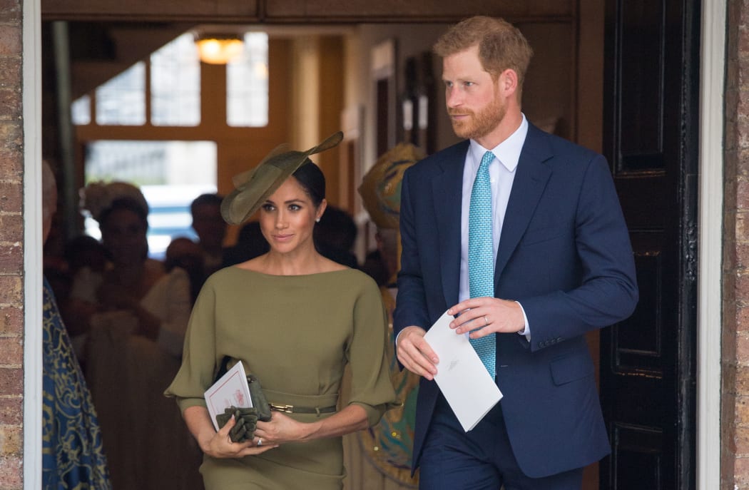 Britain's Prince Harry, Duke of Sussex and Meghan, Duchess of Sussex  leave after the christening.