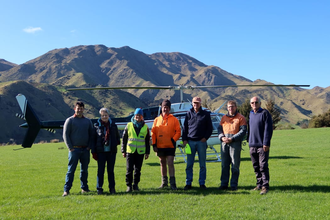 Checking out the Awatere area are, from left, trustee Stuart Dudley, councillor Barbara Faulls, trust co-ordinator Jaquetta Bradshaw, pest controller Andrew Withers, trust chair John Oswald, Marlborough Helicopter pilot Simon Moar, and trustee Ross Beech.