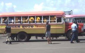 Samoa police surround bus at bus terminal in Apia for searches after student brawls in March 2016
