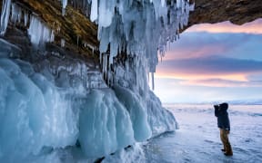 In this unlocated photo, a wonderful winter view around Lake Baikal, the largest freshwater lake by volume in the world, where pure ice and white snow are seen, southern Siberia, Russia.