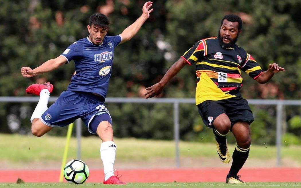 Auckland City's Emiliano Tade, (left), scored twice against Madang